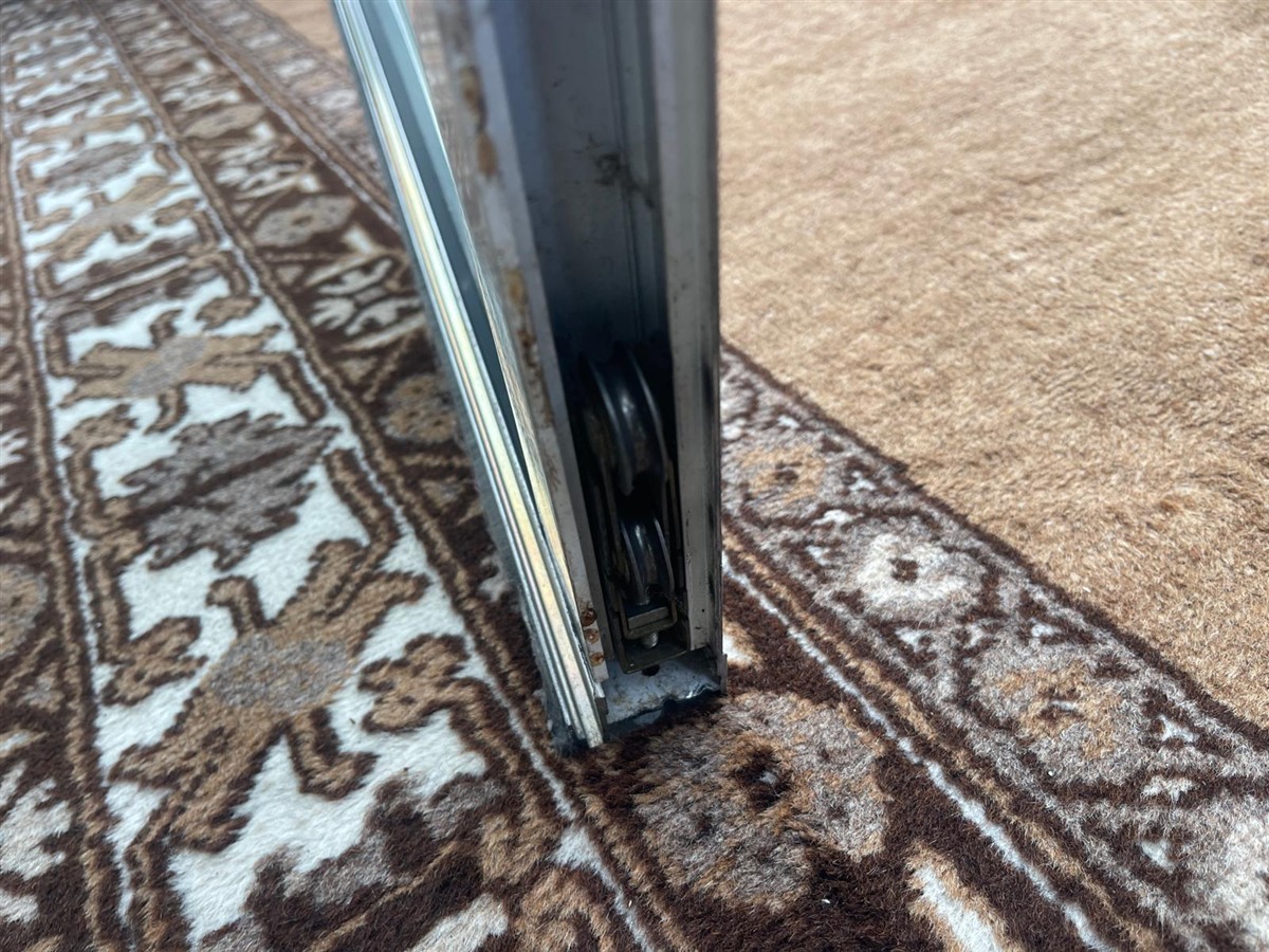 Sliding door roller repair